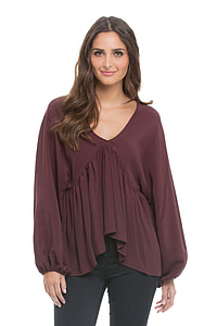 woman in brown v-neck long-sleeved top