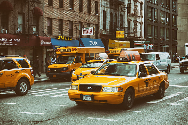 Yellow taxis and buses on the streets on Manhattan, New York City