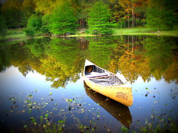 yellow canoe boat on lake