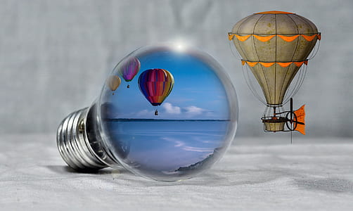 hot air balloons displaying in light bulb