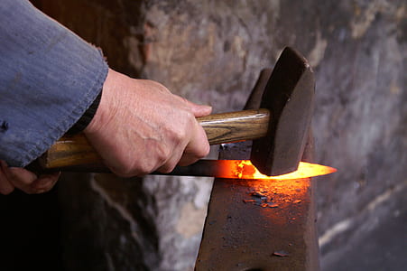 blacksmith holding hammer