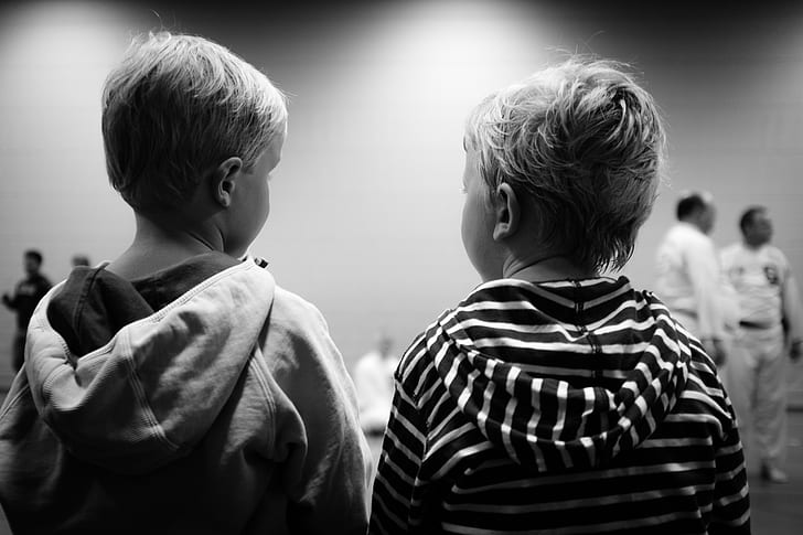 two boys staring each other