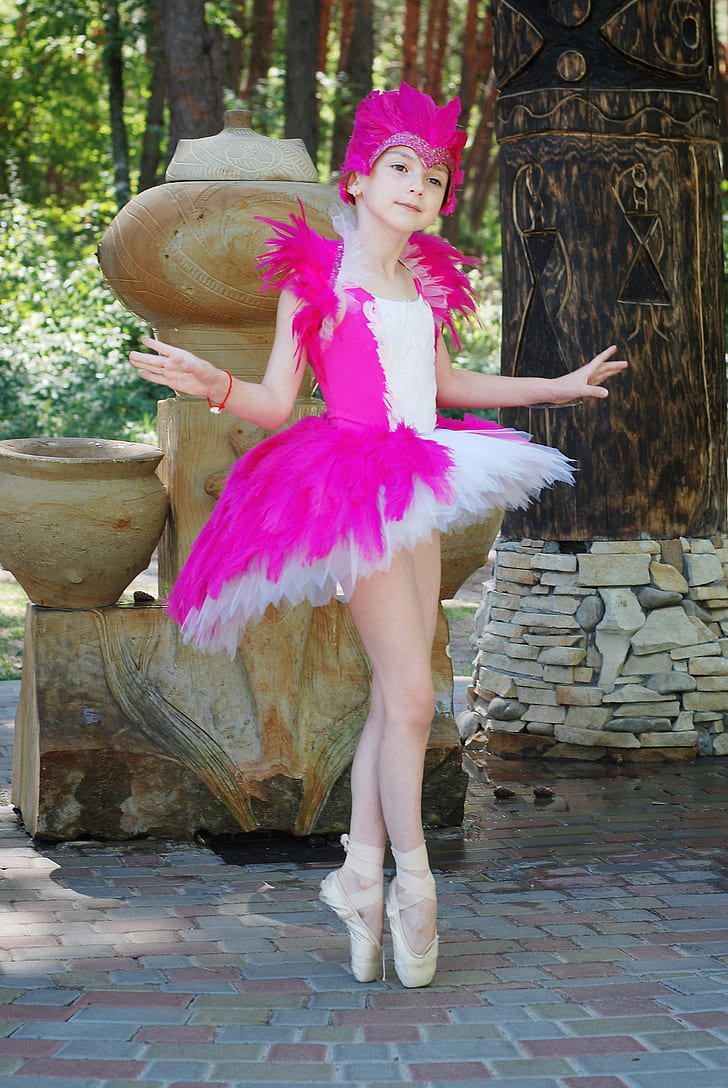 girl wearing white and pink ballerina dress