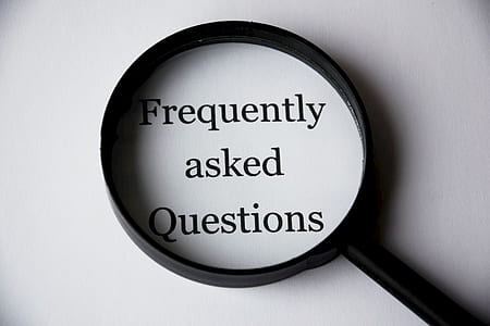 Frequently asked questions with magnifying glass