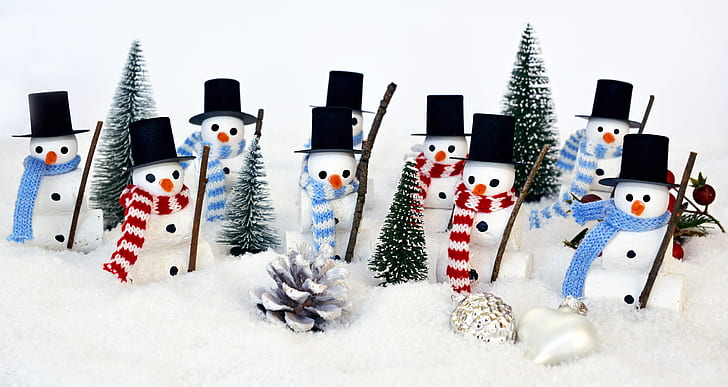 snowman figurines on snow