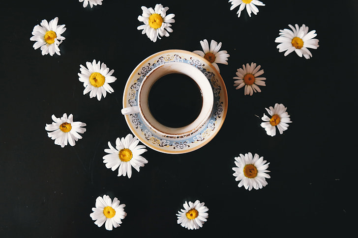 Overhead shot of coffee and flowers
