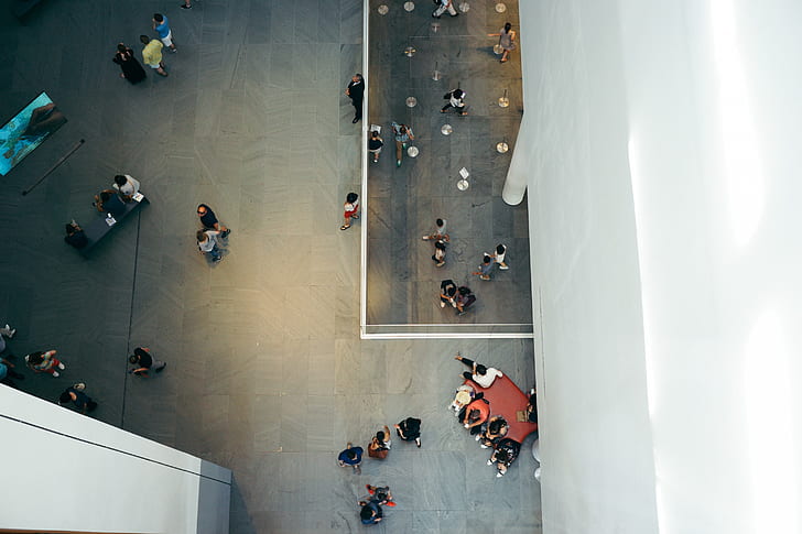 high angle view of people walking inside building