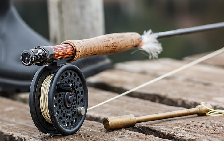 brown fishing rod with black reel