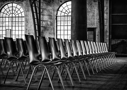 grayscale photography of armless chairs