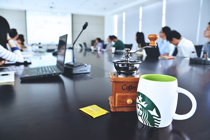 Office meeting and presentation with coffee cup