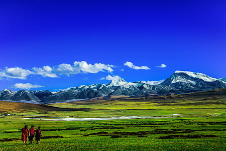 Scenic View of Mountains Against Blue Sky