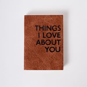 brown and black leather Thing I Love About You printed decor