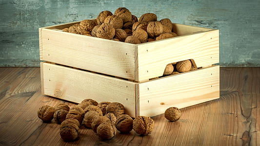 brown wooden crate with nuts