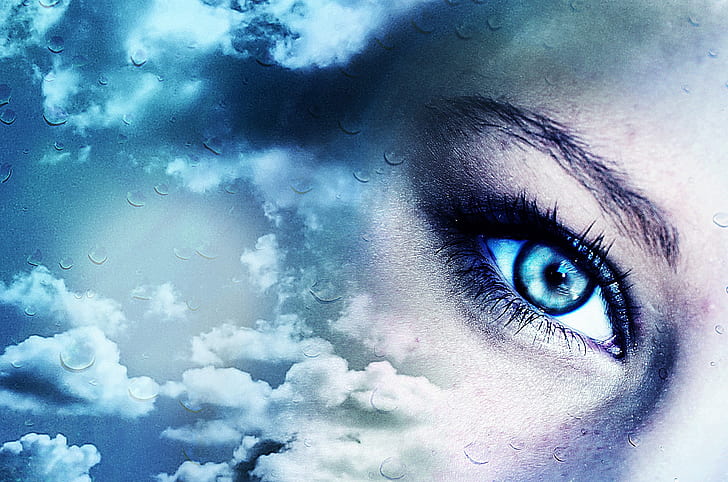 poster of woman's eye and clouds