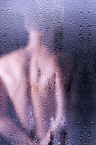 water droplets at clear glass shower stall