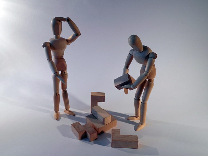 two wooden character toys