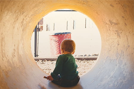 boy inside a concrete tunnel