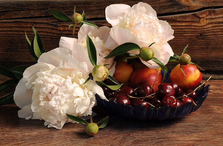 white flowers and red tomatoes
