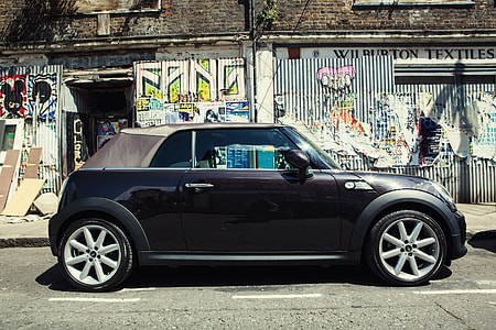 Wide-angle shot of a Mini car, image captured on the streets of East London, England