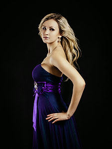 woman wearing purple strapless dress