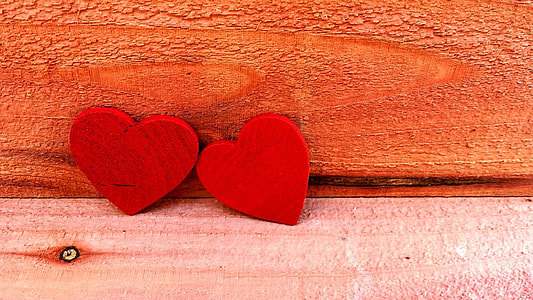 two red heart wooden wall decors