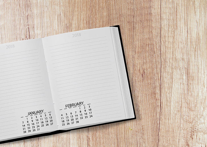 white notebook with calendar