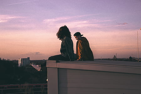 girl and man on roof top