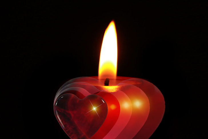 Red burning heart shaped candle Stock Photo by ©zmaris 4654859