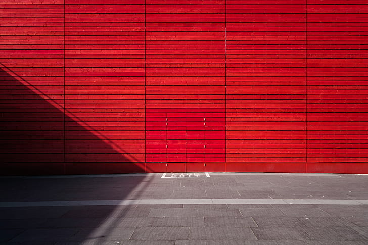 photo of red wall and gray floor