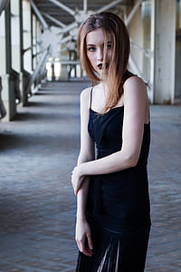 woman wearing black spaghetti strap top and skirt