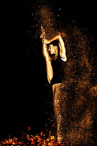 woman wearing black body suit dancing on fire digital wallpaper