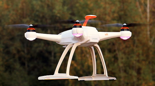 photo of white quadcopter