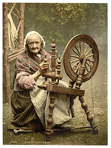 woman in front of spinning wheel