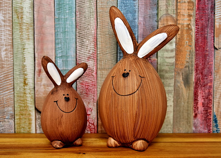 two brown-and-white bunny decors