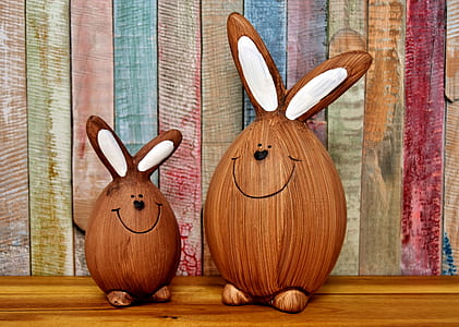 two brown-and-white bunny decors