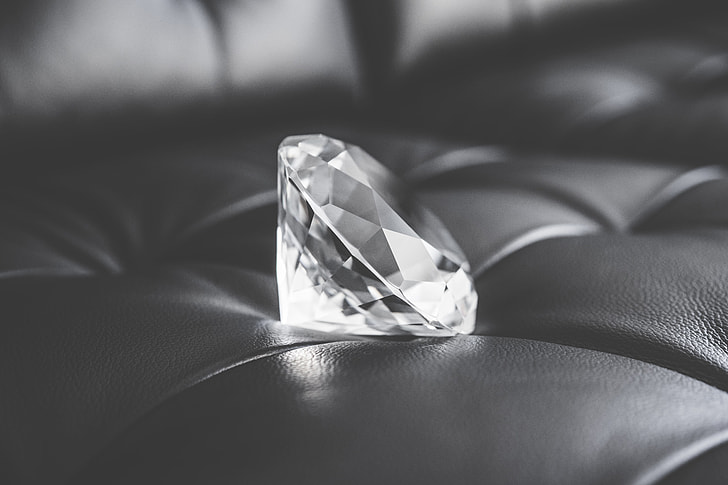 Big Glass Diamond Crystal on Black Leather Sofa