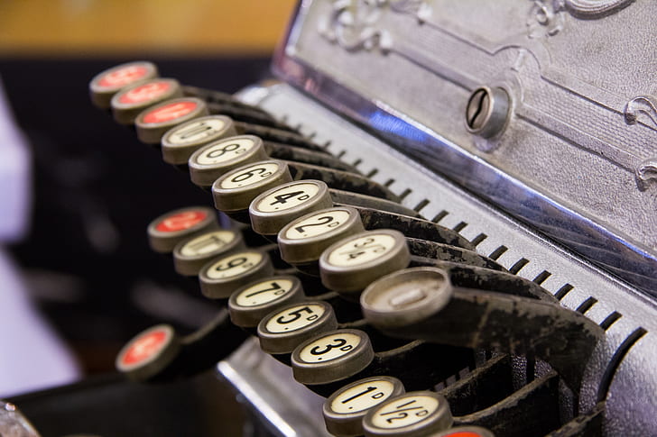 close photo of gray brail typewriter