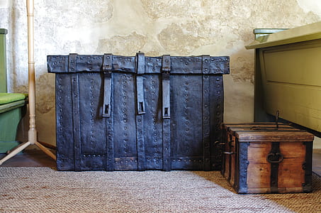 black and brown wooden chest boxes