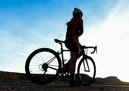 woman on road bike during daytime