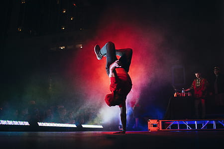 man doing hand stand on stage