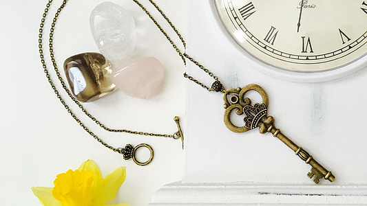 gold-colored skeleton key pendant necklace