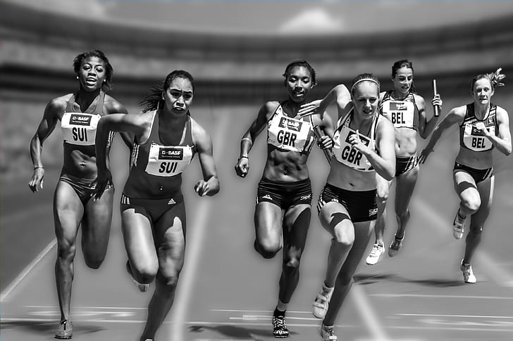 six women running on field during daytime