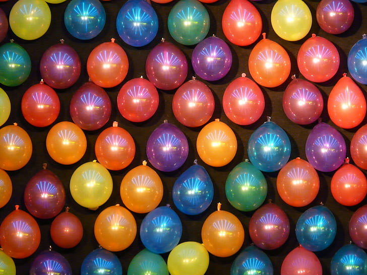 assorted-color balloons on wall