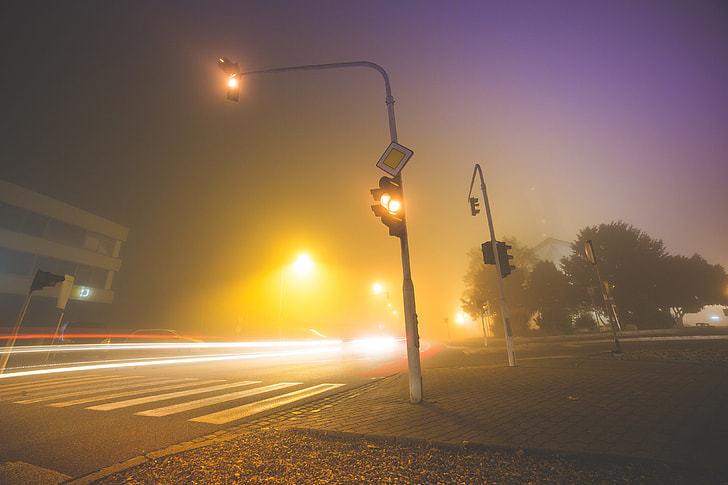 Car Lights & Crossroad Traffic Lights in The Fog