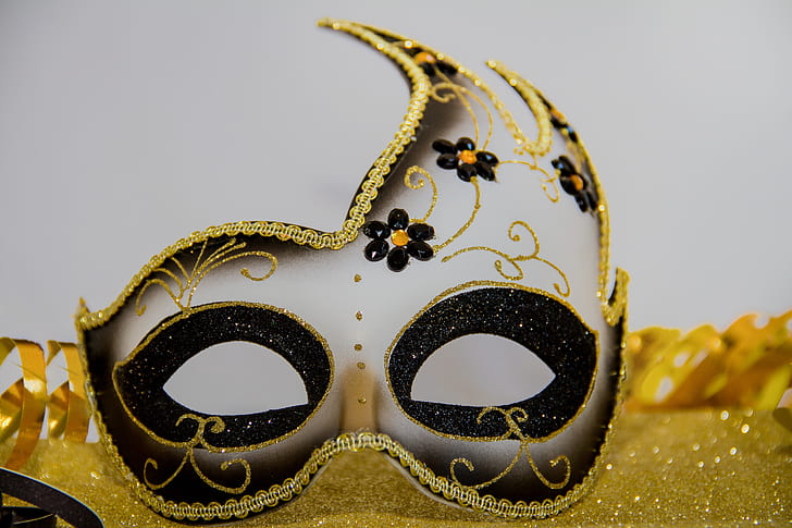 gray and gold masquerade mask