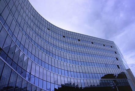 Fish Eye View Photo of Glass High Story Building over White Cloudy Sky during Daytime
