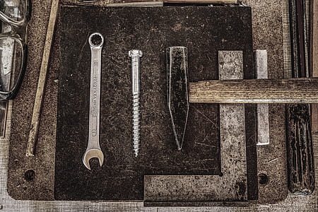 six gray steel hand tools