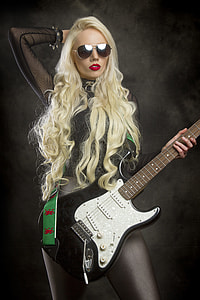woman holding electric guitar