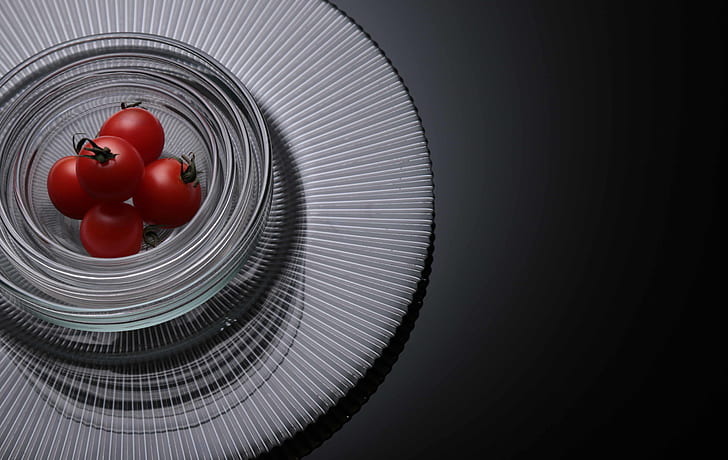 Five Tomatoes on Clear Glass Bowls