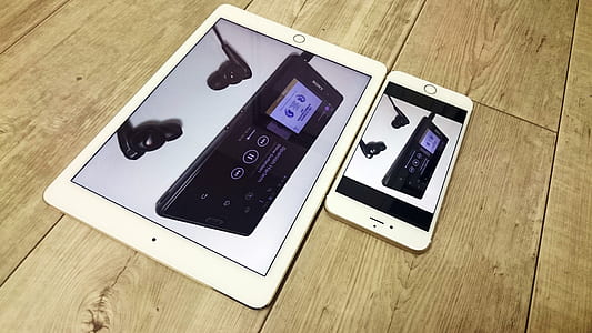 silver iPad beside silver iPhone 6